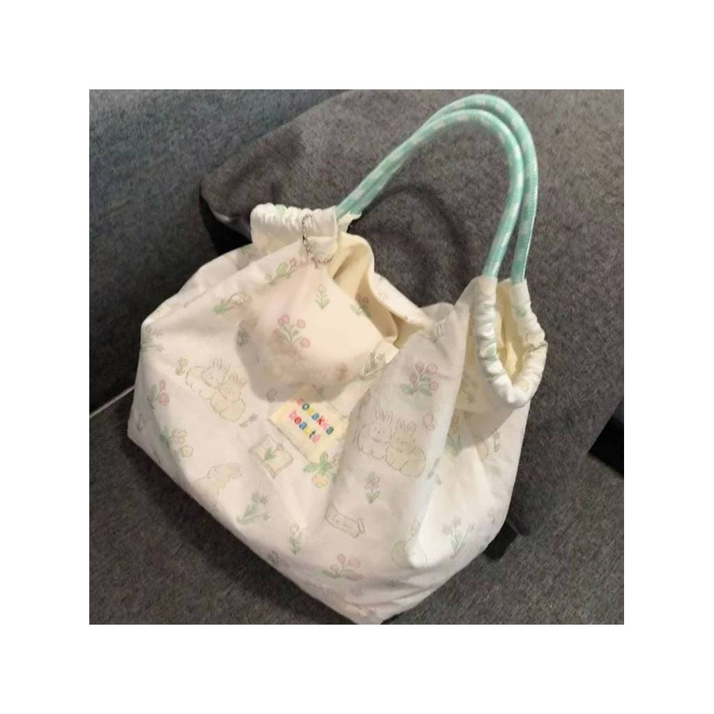 2025 pequena impressão fresca bonito coelho bolsa de ombro estudante feminino versão coreana bolsa de lona dos desenhos