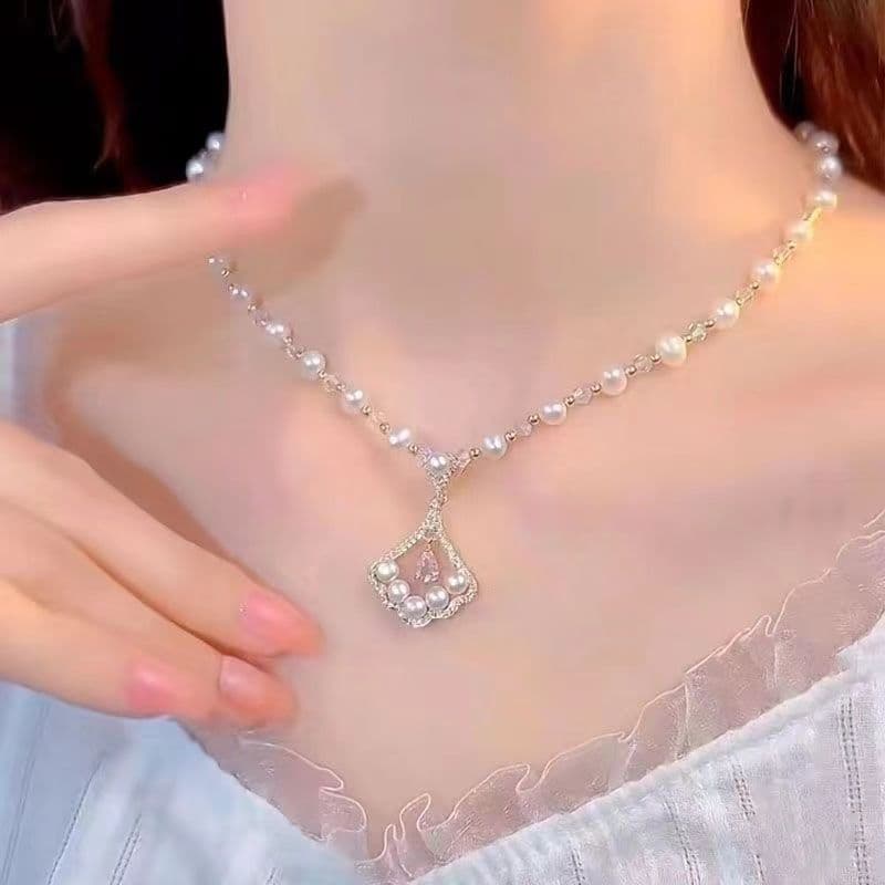 Sansheng Xingxing Ginkgo folha pérola colar feminino luz luxo nicho Design High-End clavícula corrente 2026 colar2026051