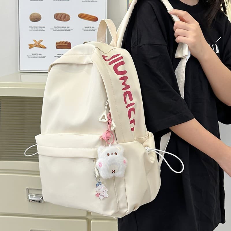 Mochila feminina, mochila com estampa de letras, mochila casual, mochila estilosa, mochila versátil, mochila escolar par