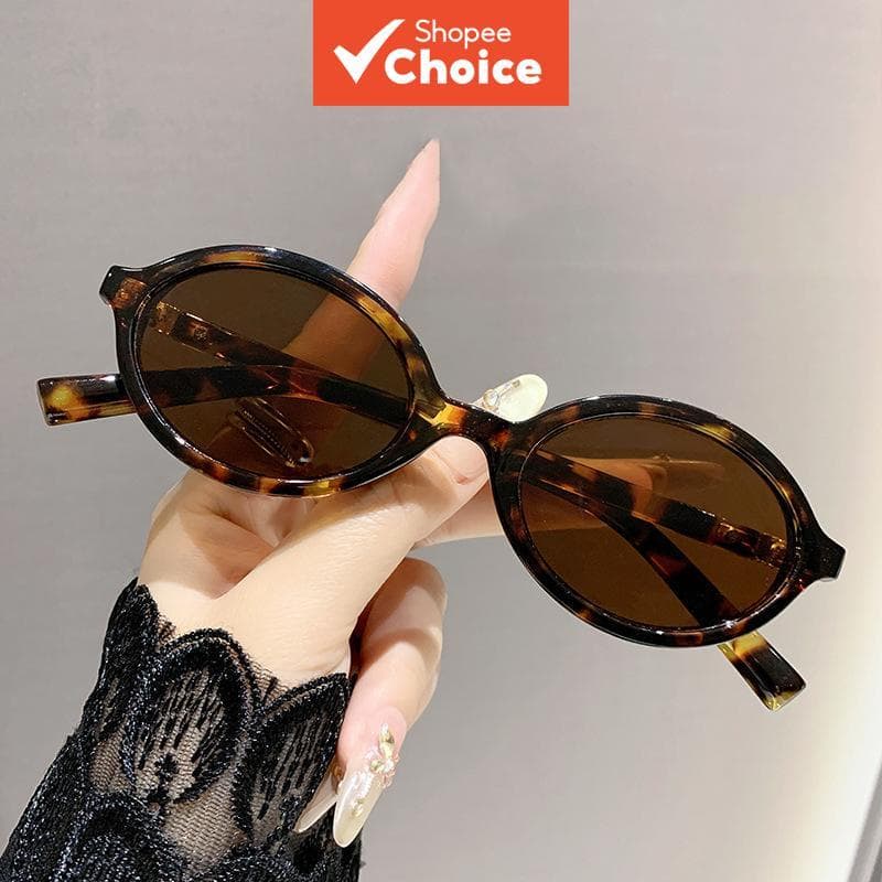 Óculos de sol feminino oval retrô, com proteção UV400, padrão de tartaruga, estilo moderno.