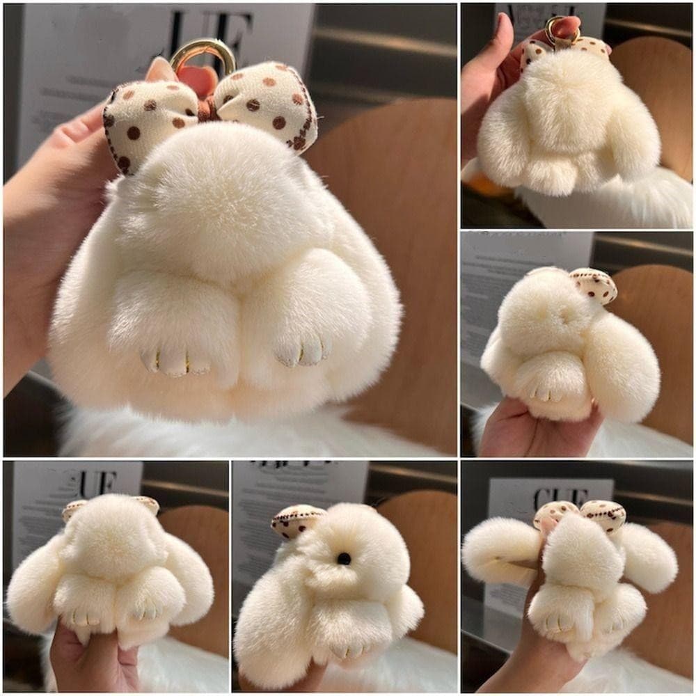 Chaveiro de pele de coelho, decorado com um laço de pelúcia fofo.