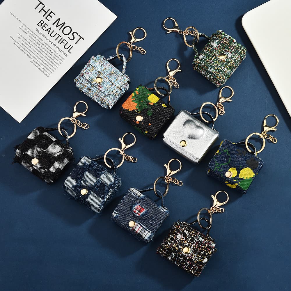 Mini bolsa estilosa com chaveiro para mochilas e bolsas, bolsa de armazenamento, porta-moedas, estojo para fones de ouvi