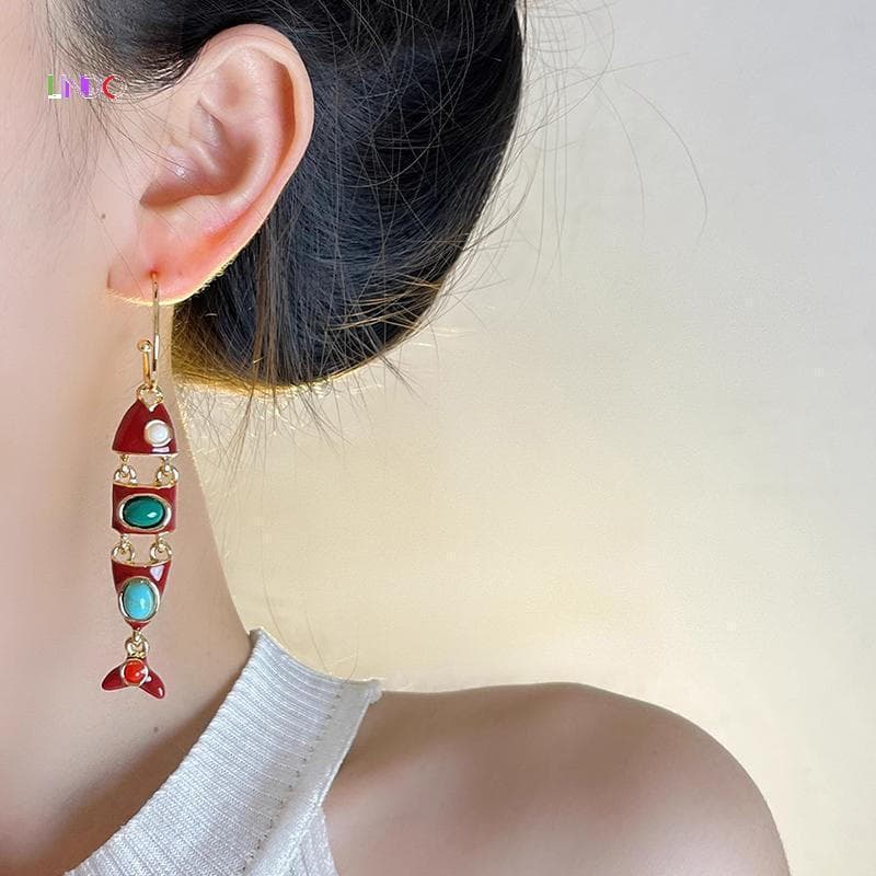 Brincos longos em formato de peixe, estilo étnico, esmalte vermelho, adequados para mulheres usarem em festas e casament