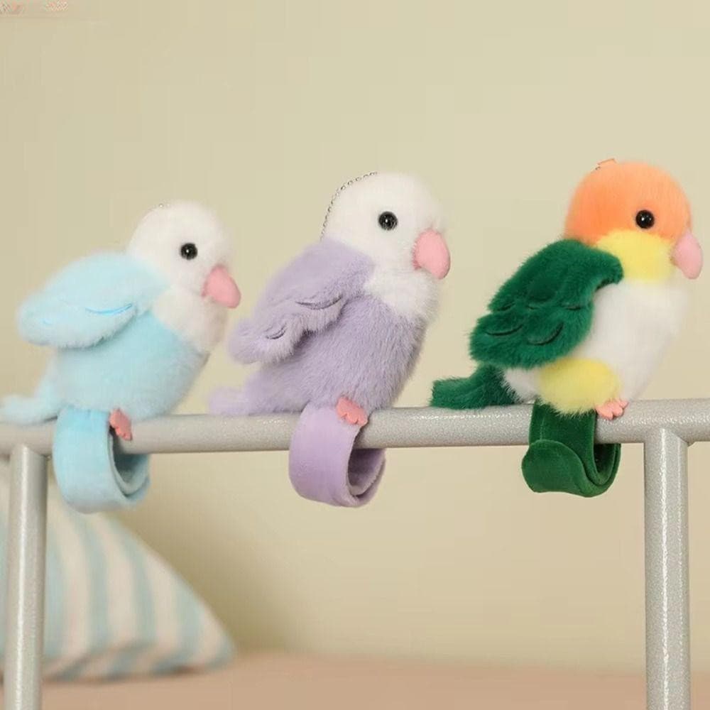 Brinquedo de pulso em forma de papagaio, chaveiro de pelúcia, boneco elástico que bate palmas.