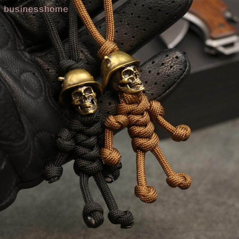 < busines > 1PC Crânio Cabeça Chaveiro Carro Motociclista Capacete Pingente Corda Trançada Paracord Saco Pendurado Bapa