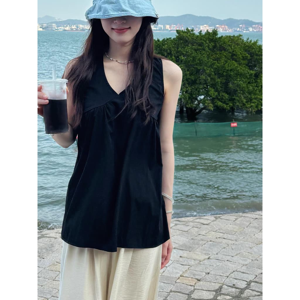 Camisola preta exclusiva francesa, roupa externa feminina, verão 2026, nova venda quente, roupa à beira-mar, solta, sem
