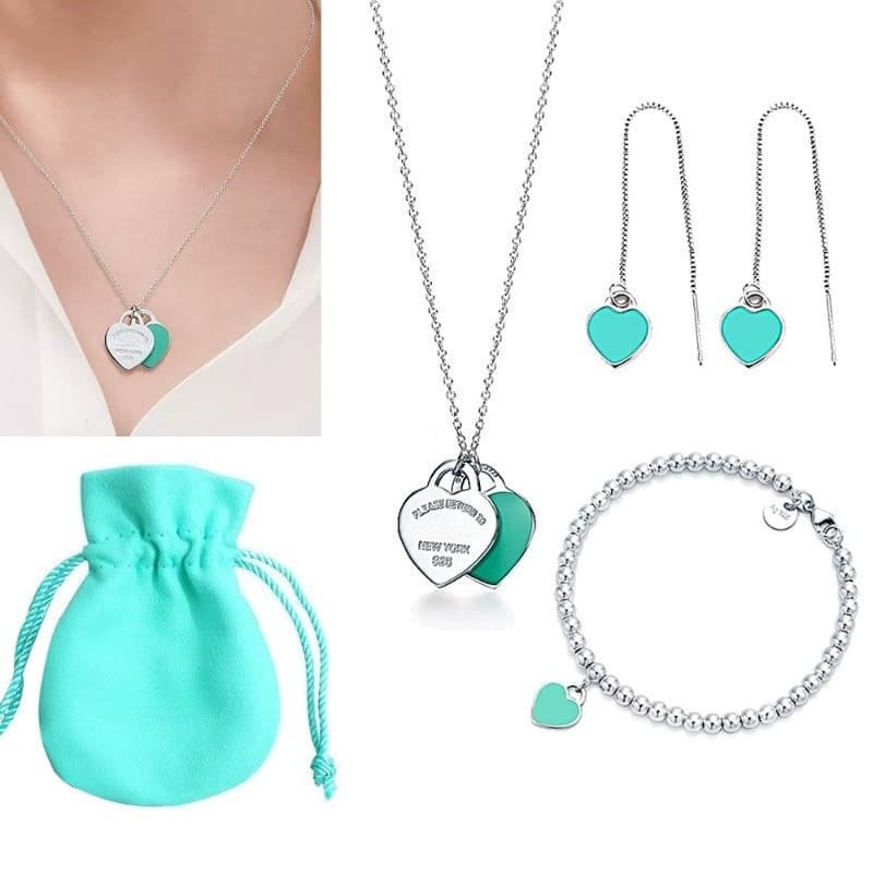 Conjunto de 3 peças (colar + pulseira + brinco) em prata 925, pingente de coração azul, inclui bolsa de veludo azul. JVT