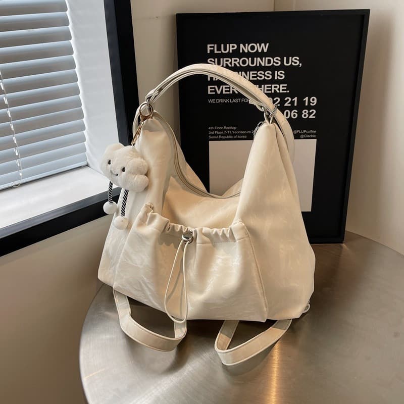Bolsa tote e mochila feminina feita de tecido impermeável, estilo coreano, com pingente de nuvem de algodão, adequada pa