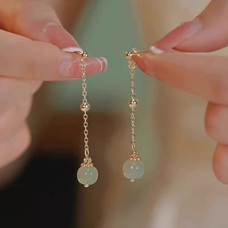 brincos feminino brinco feminino Estilo longo imitação Hetian Jade borla brincos feminino temperamento estilo chinês bri