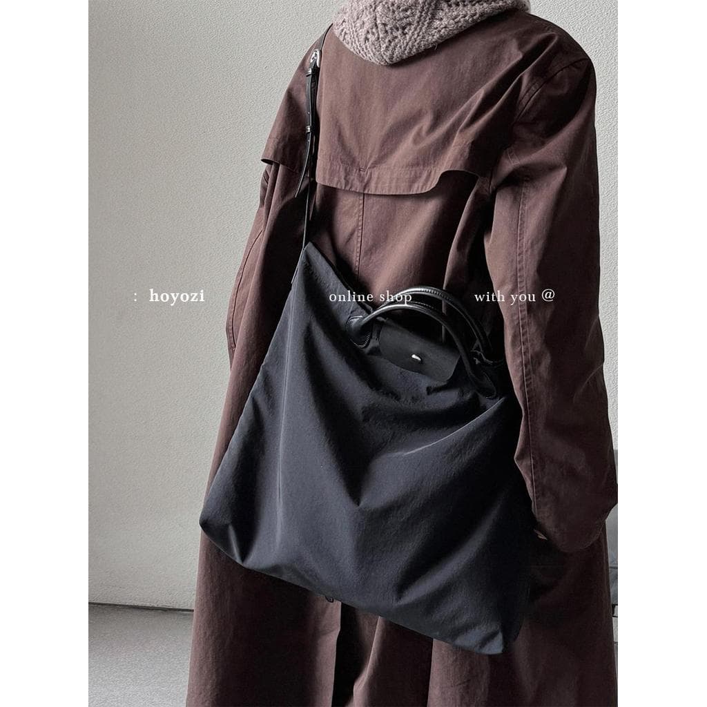 [Bolsa Xiaoyoujia] HOYOZI Couro Genuíno Pano de Nylon Portátil Commuter Cross-body Bolsa Grande Feminina 2026 Novo Estil