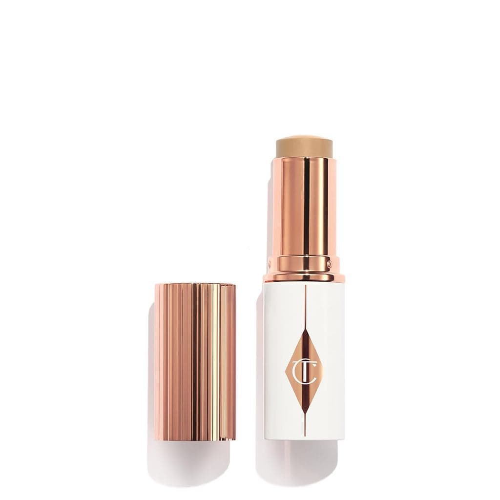 Charlotte Tilbury Unreal Tint & Sheer Glow Moisturizing Foundation Stick - Produto de Maquiagem com Cobertura Leve a Méd