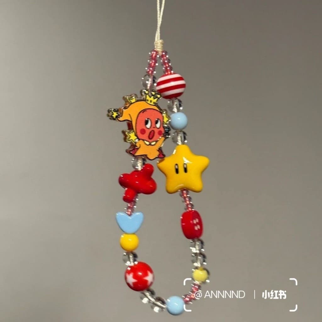 Corrente de telefone móvel estrela amarela estéreo estrela pessoas pingente frisado pulseira de telefone móvel pingente