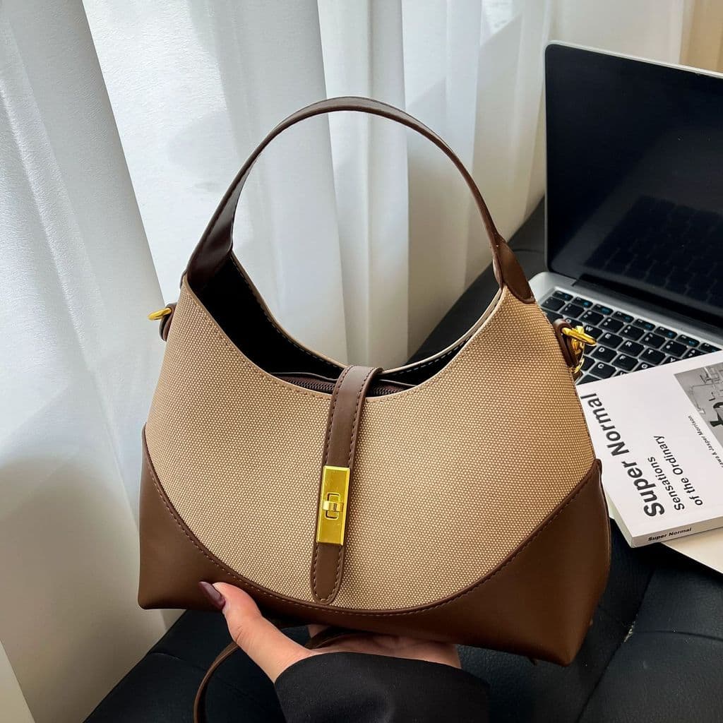 Bolsa feminina de design exclusivo e cores contrastantes, modelo novo de 2026, estilo "dumpling bag", versátil para o di