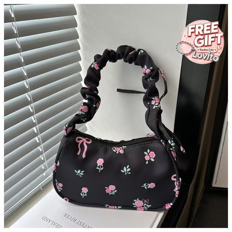 Uma bolsa com padrão floral de design exclusivo, com pregas e cordão ajustável, é elegante e versátil, podendo ser usada