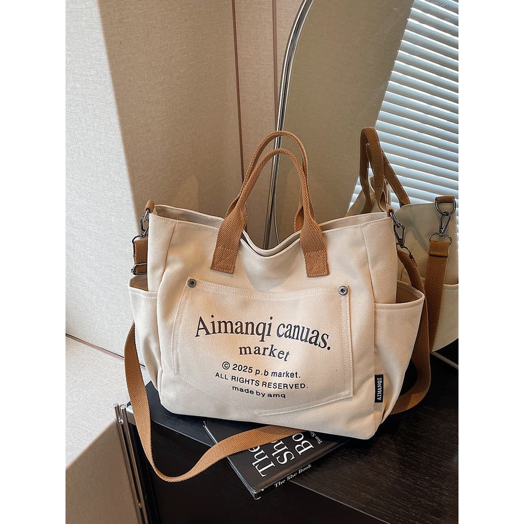 Bolsa Tote de lona de grande capacidade feminina 2025 novo estilo Casual carta de um ombro bolsa de viagem classe de est