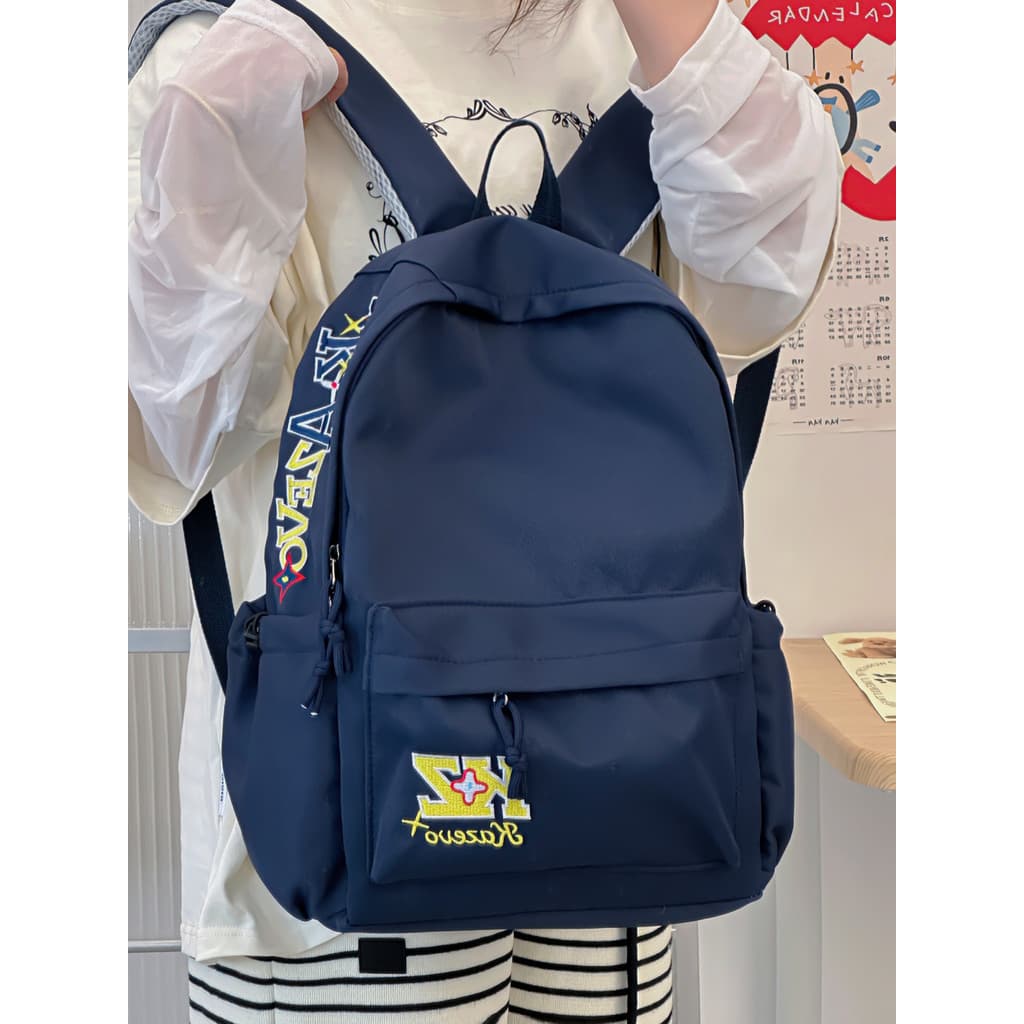 Estilo coreano na moda legal das mulheres dos homens moda mochila bordada carta mochila estudantes do ensino médio mochi