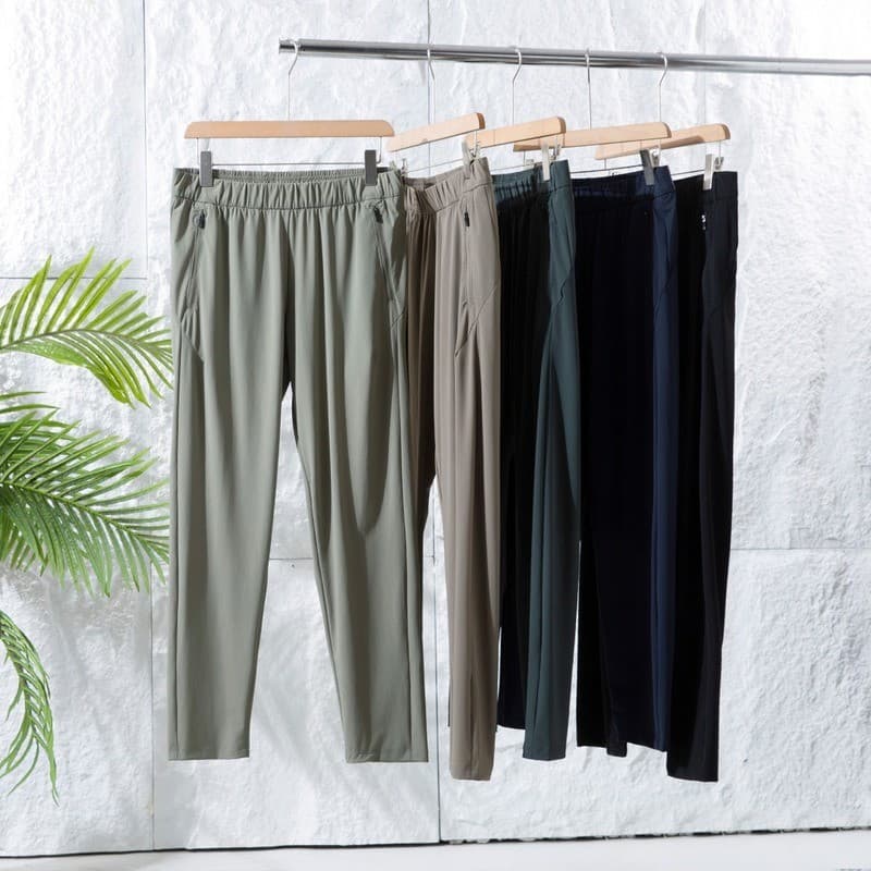Verão masculino de secagem rápida estilo fino Drape sedoso ar condicionado calças soltas calças casuais calças de moleto
