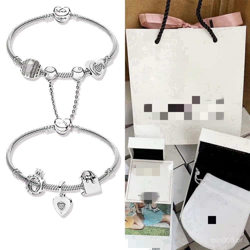 Conjunto de pulseira e pingente em liga banhada a prata 925, incluindo estojo de armazenamento.
