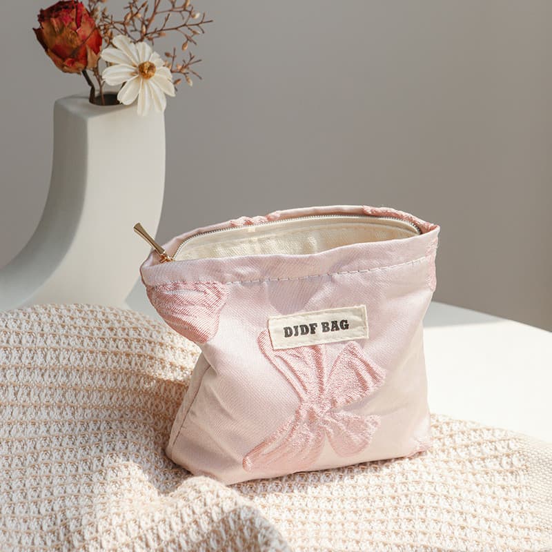 Mini arco rosa pequeno saco cosmético feminino portátil de alto valor bolsa de moedas lona batom saco