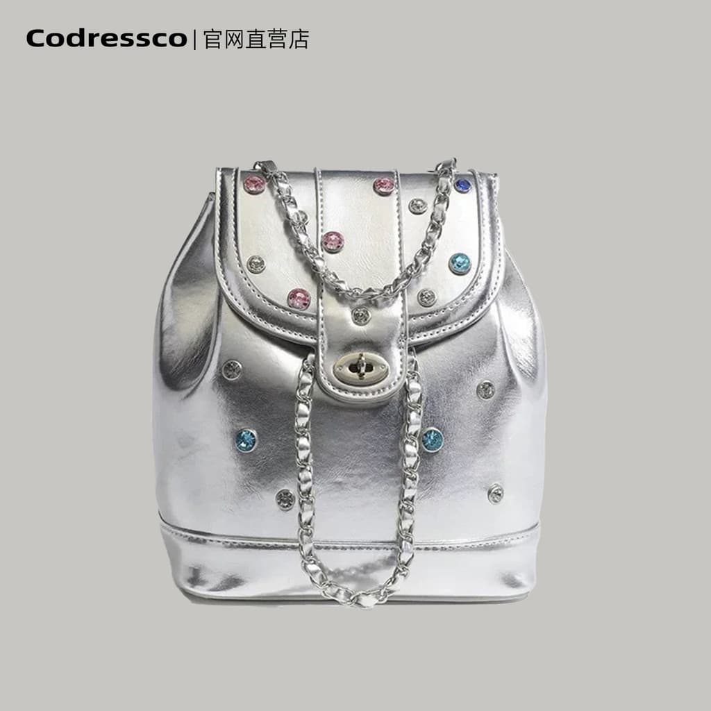 Mochila coreana Blogger nicho 2026 novo estilo estilo coreano corrente prata preto pequena mochila saco de viagem femini