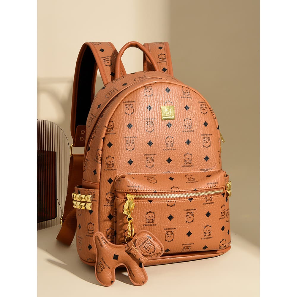Muzi rua mochila feminina 2026 novo estilo moda versão coreana urso Casual grande capacidade saco de escola All-Match re