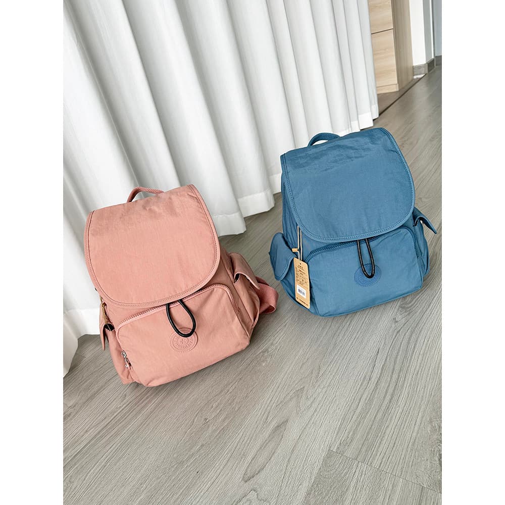 2026 novo estilo mochila Casual moda leve mochila de viagem repelente de água saco de pano tipo capa mochila Commuter
