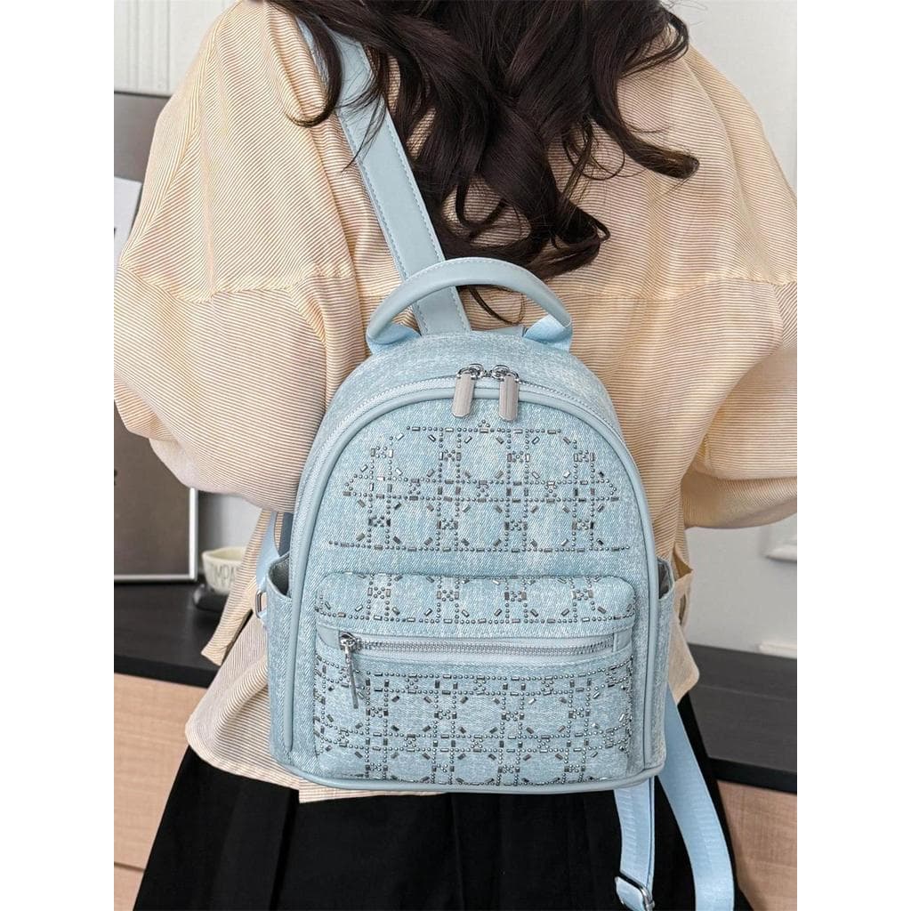 Muzi Street High-End sentimento quente diamante mochila senhoras 2026 novo estilo moda versão coreana luz luxo All-Match
