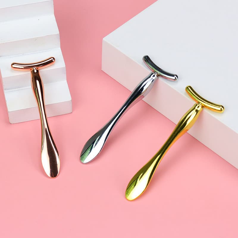 Bastão de massagem ocular em forma de T de metal, de dupla função, com espátula para aplicação de creme para os olhos, b