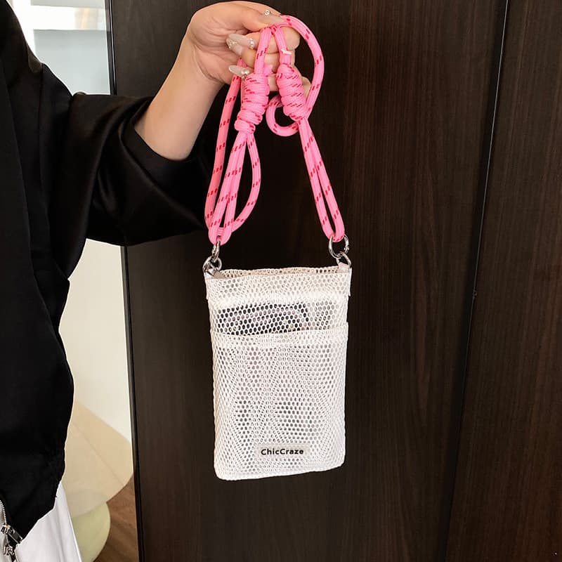 Doce pequeno fresco saco do telefone móvel feminino 2025 verão novo estilo oco bolsa de ombro Cross-corpo malha saco de