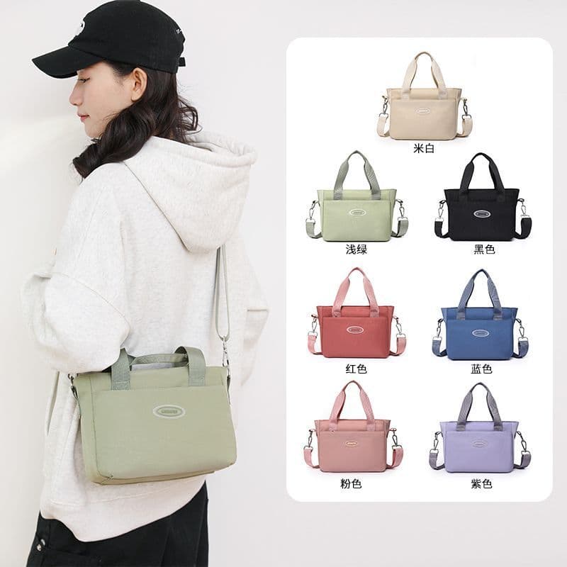 Bolsa feminina 2026 novo estilo Casual versão coreana cor sólida moda grande capacidade bolsa feminina portátil bolsa de