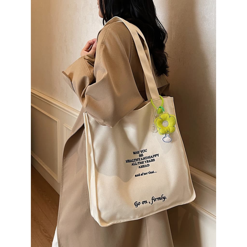 Bolsa de lona feminina 2026 novo estilo letras bordadas estudante classe portátil saco de livro grande capacidade um-S