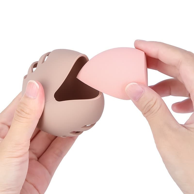 Feita de silicone durável, a caixa de armazenamento para esponjas de maquiagem é uma ferramenta de armazenamento ecológi