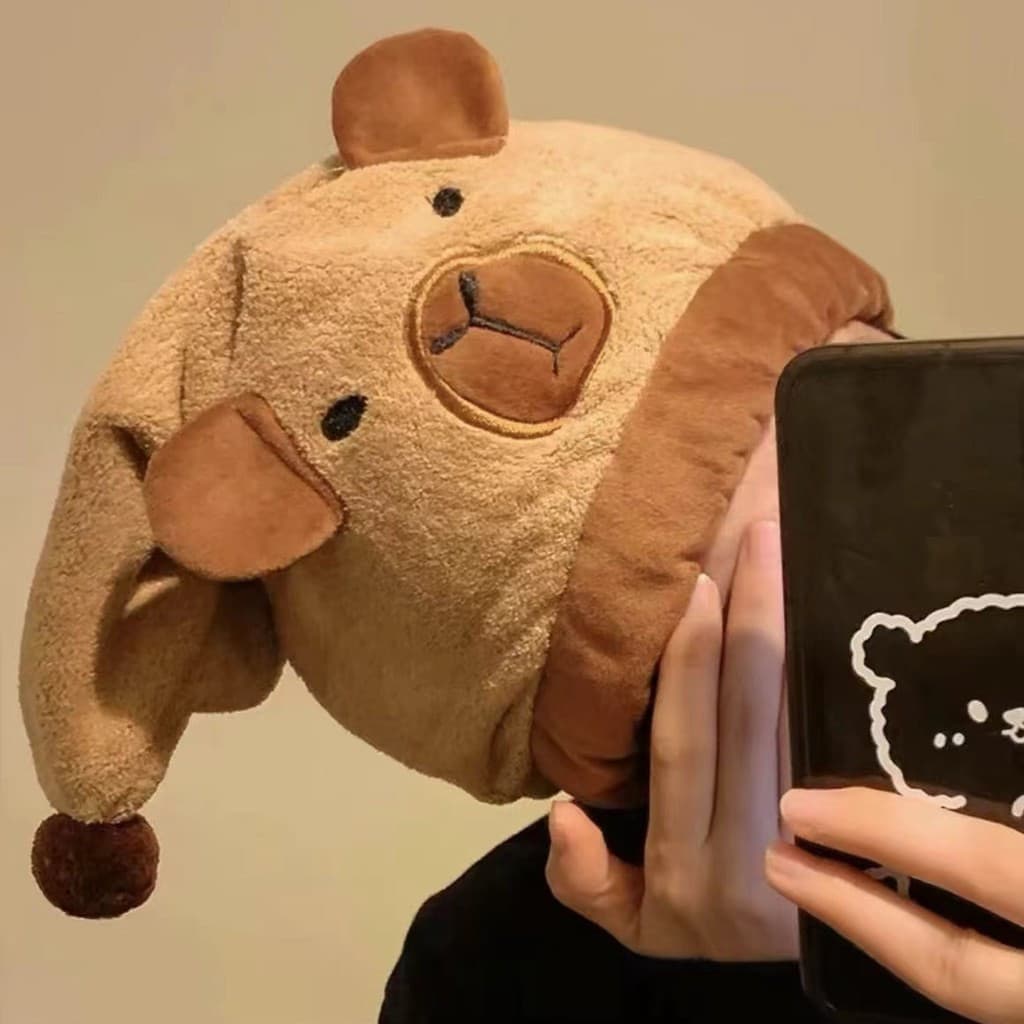 Duas toalhas de cabelo em lã coral com formato de capivara, macias, absorventes e de secagem rápida.