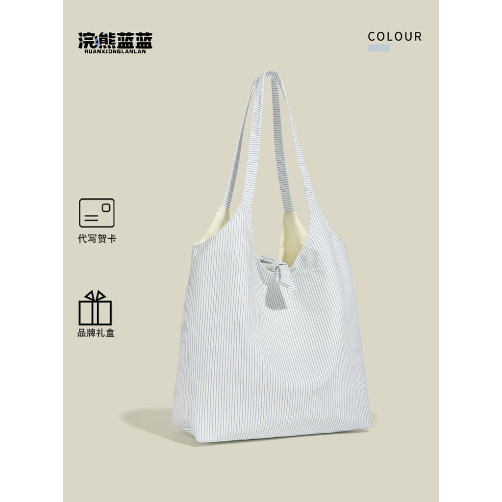 Guaxinim azul azul nicho Design listrado bolsa de lona feminina 2026 novo Casual All-Match Commuter ombro de grande capa