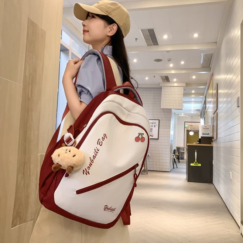 Versão coreana pingente mochila feminina estudantes do ensino médio nicho de alto valor estudantes do ensino médio Super