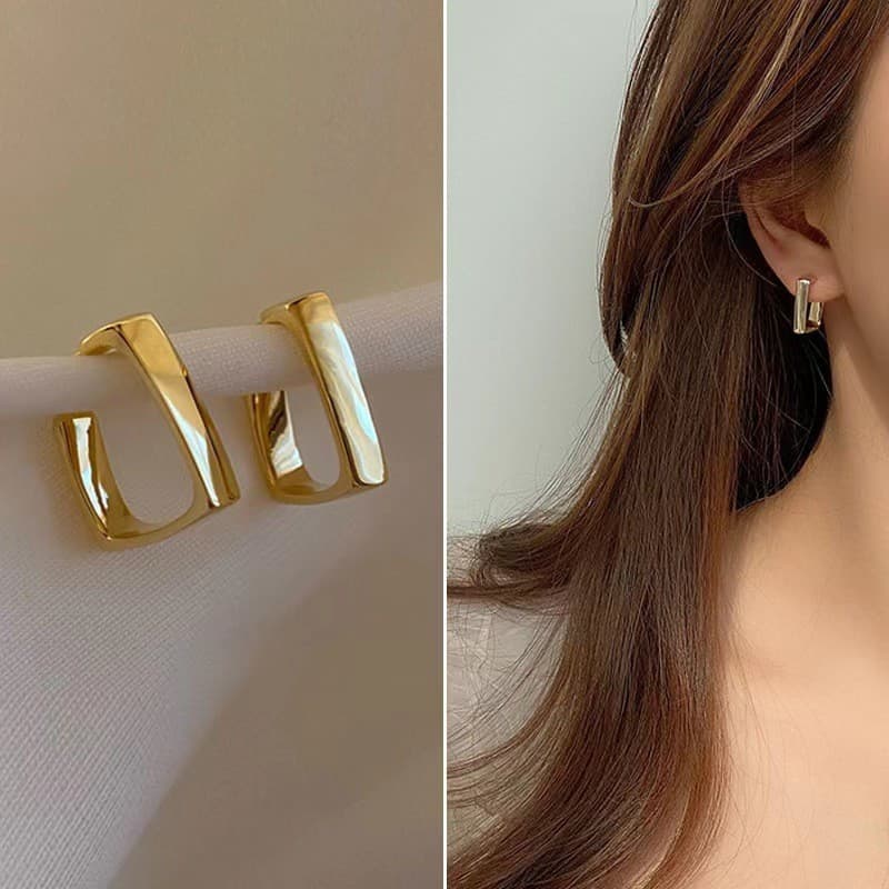 Acessórios com atmosfera de outono e inverno: brincos de metal simples, levemente luxuosos e elegantes, com pino de prat