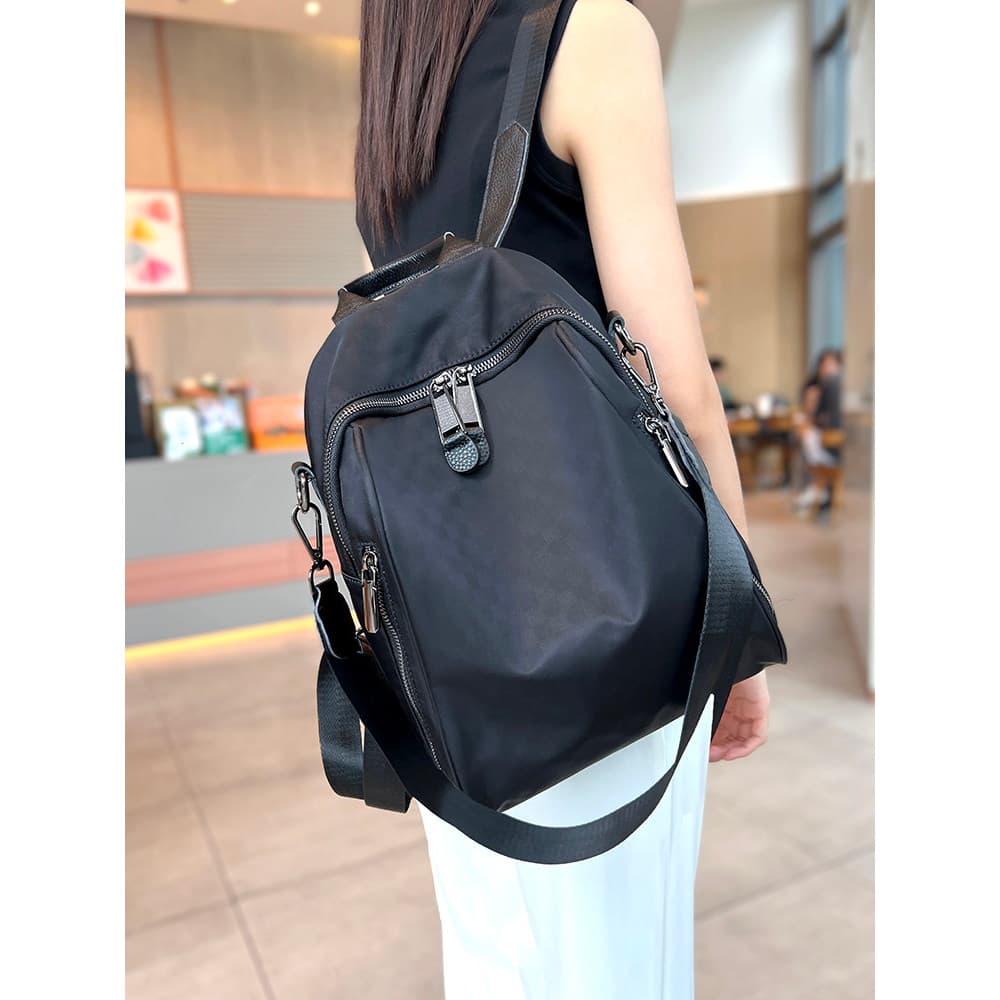 Casual leve médio mochila feminina 2026 novo estilo impermeável All-Match Oxford pano mochila impressa na moda saco de d
