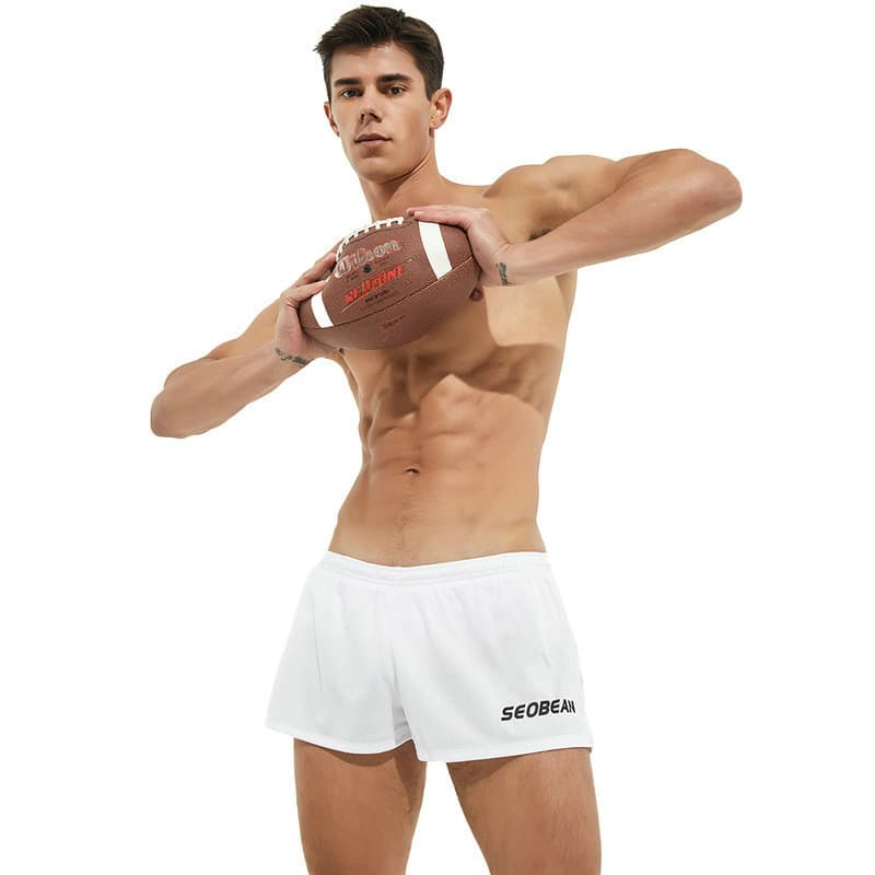 Shorts esportivos masculinos de camada dupla de cor sólida da moda com forro