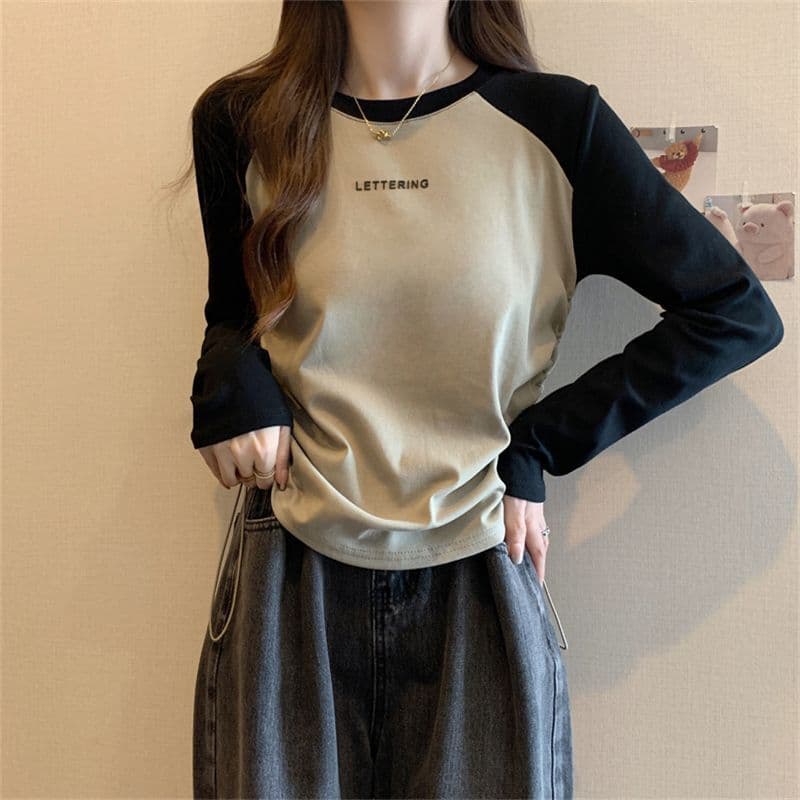 Camiseta feminina de manga comprida primavera outono solta mais magro olhar Casual All-Match nicho cordão topo