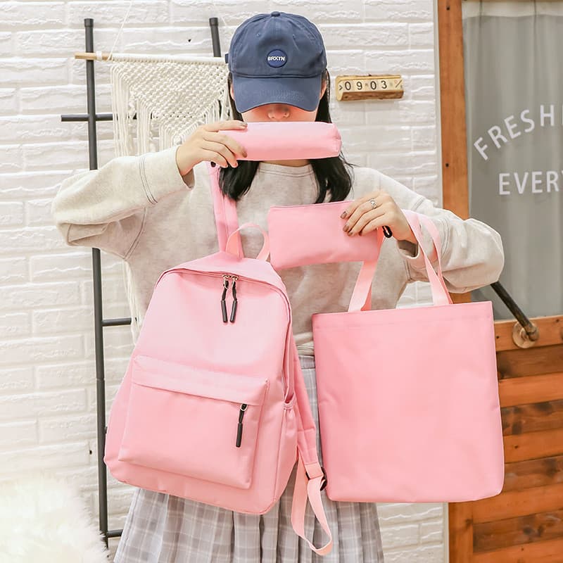 Novo estilo mochila grande capacidade feminina versão coreana mochila Casual conjunto de quatro peças leve macio saco es