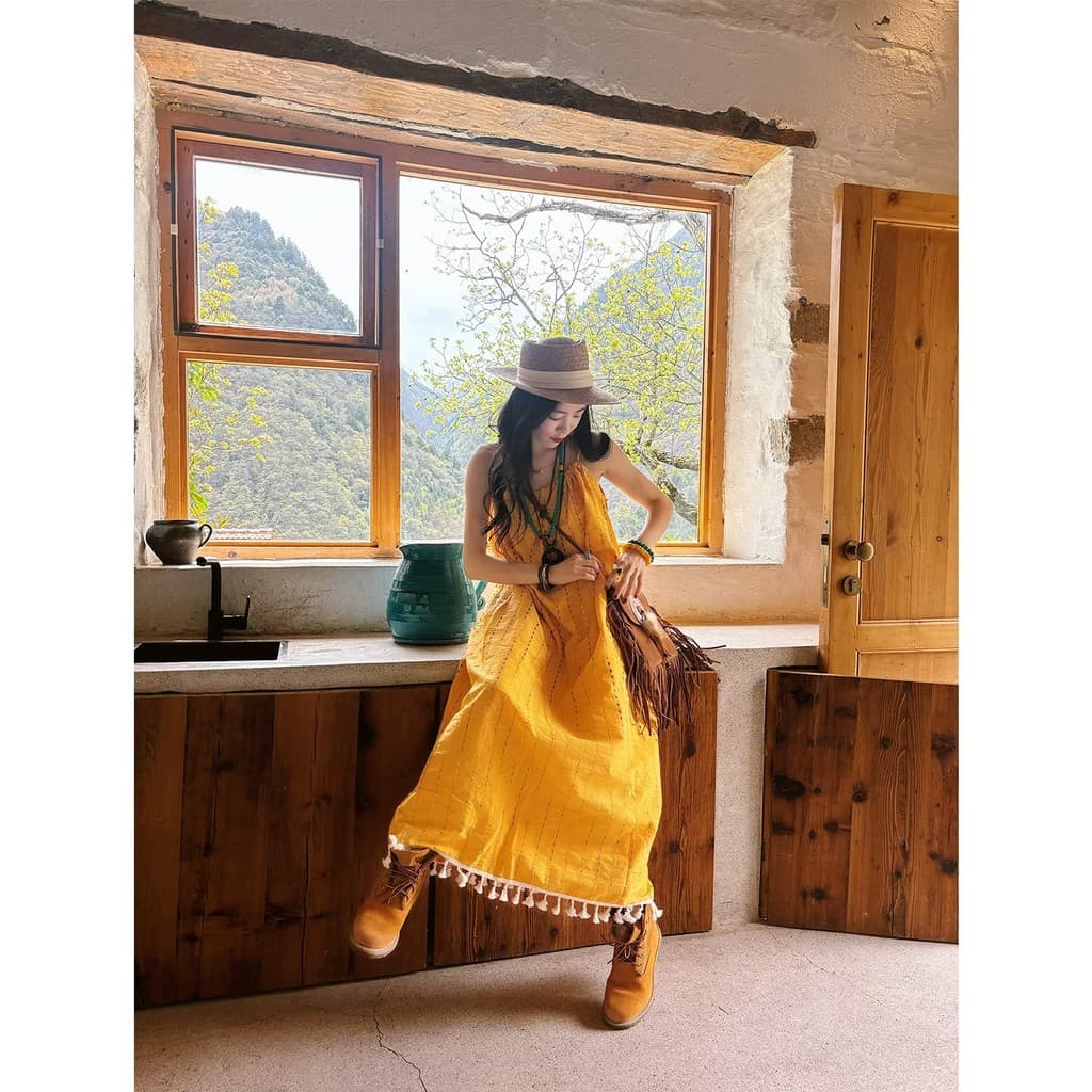 Estilo de férias amarelo borla estilingue vestido feminino verão 2025 novo estilo elegante solto All-Match A linha saia