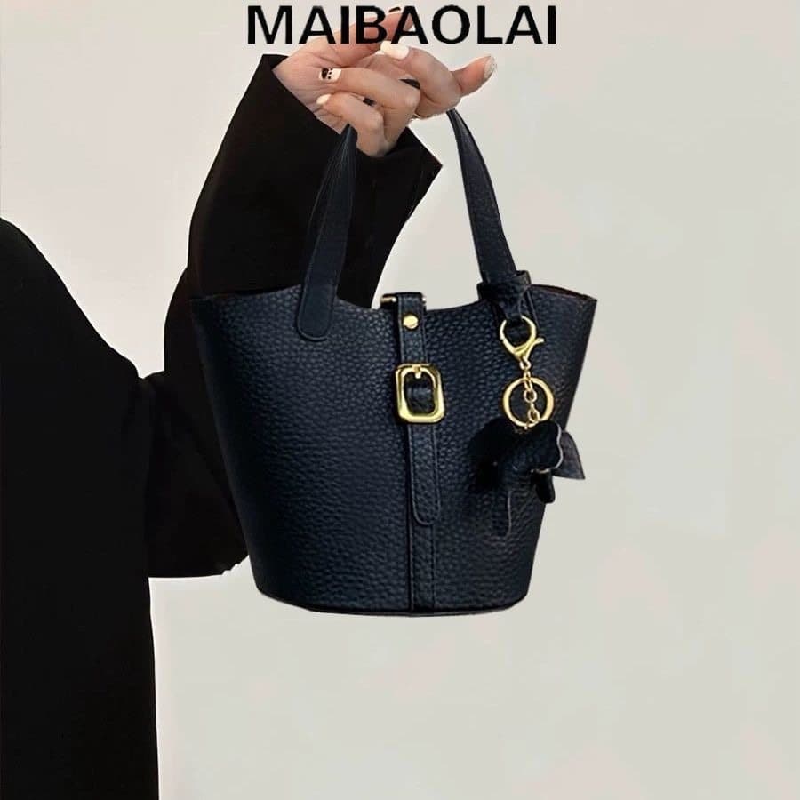 Super quente high-end sentimento 2026 high-end sentimento cor sólida lichia padrão criança mãe prato cesta saco bolsa de