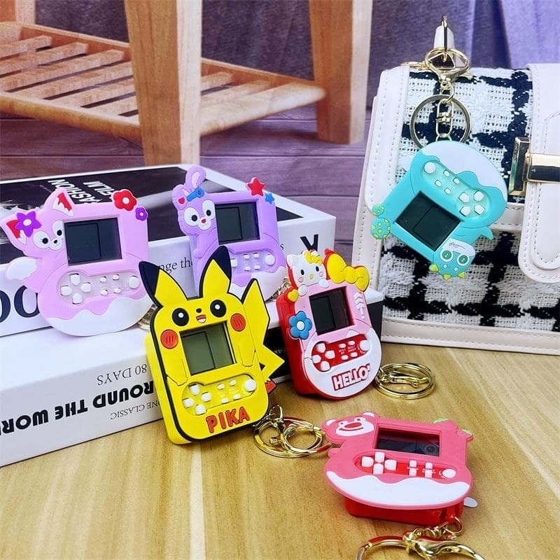 Mini Animal dos desenhos animados Pikachu estrela Delu palma Tetris Console de jogos brinquedo chaveiro pingente de corr