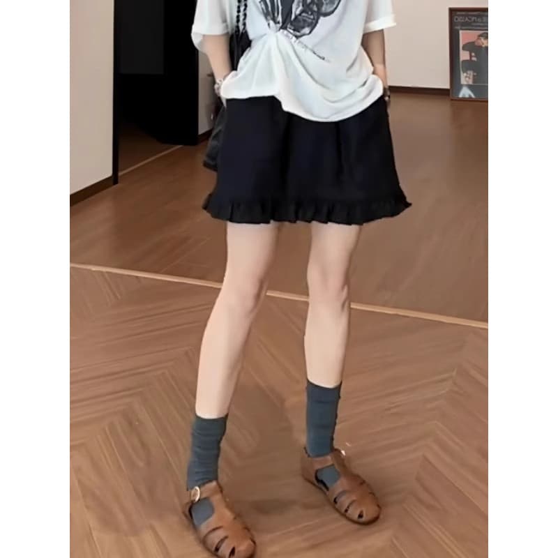 Novo tamanho grande roupas femininas Design sentir fungo borda cintura elástica saia curta preta com calças de segurança