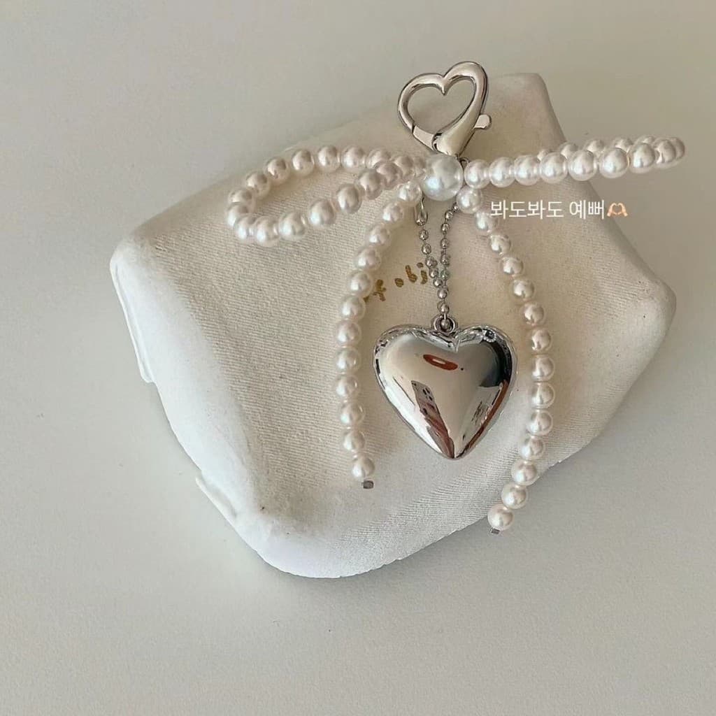 Ll nicho Design simples doce pérola arco prata amor pingente carro chaveiro airpods pingente saco