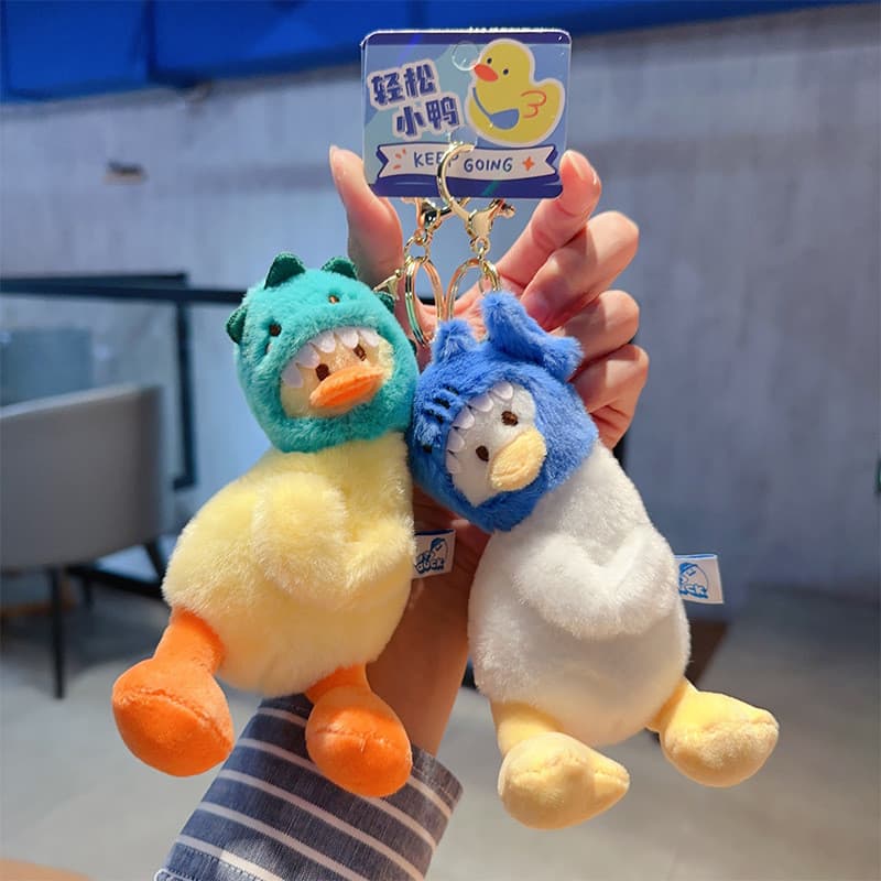 Dinossauro novo produto ornamentos pato cabeça torta tubarão genuíno pequeno presente chaveiro 2025 garra máquina boneca