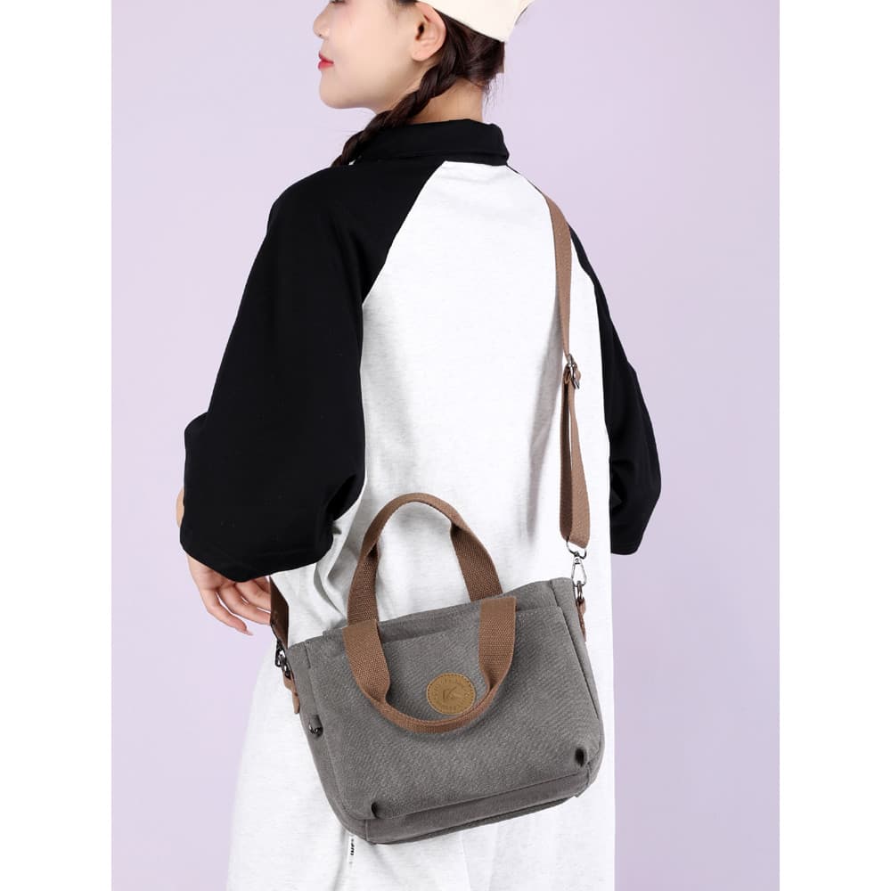 Bolsa de lona de algodão bolsa feminina 2026 primavera novo estilo trabalho Commuter portátil bolsa mensageiro de ombro