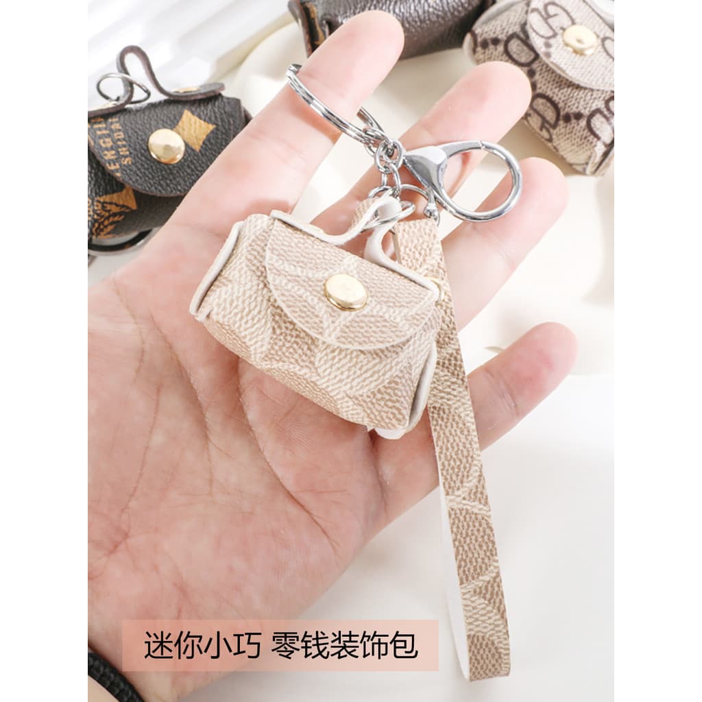 2026 novo estilo criativo fone de ouvido armazenamento moeda bolsa airpods caso protetor chaveiro pingente corrente do c
