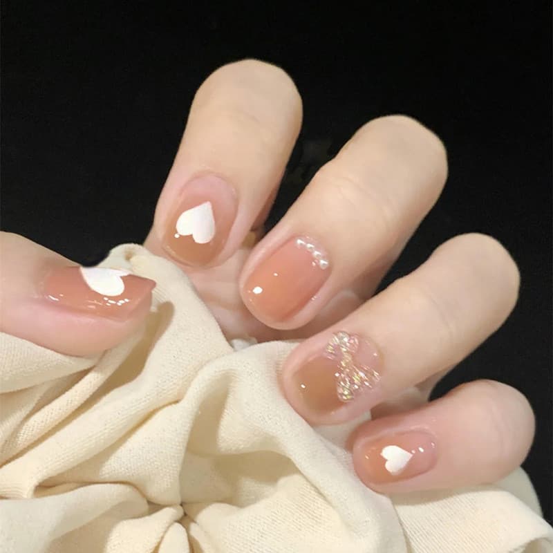 Unhas curtas vestíveis pérola amor coração arco High-End unhas falsas destacáveis adesivos de unhas Manicure adesivos un