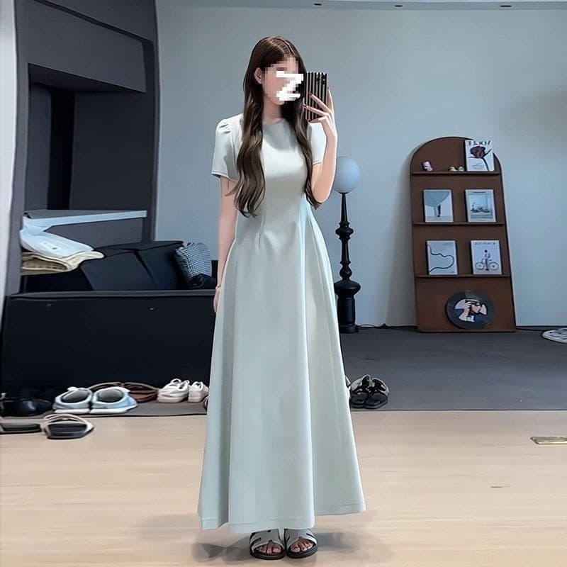 Vestido francês de cintura estreita com aparência mais fina e saia longa